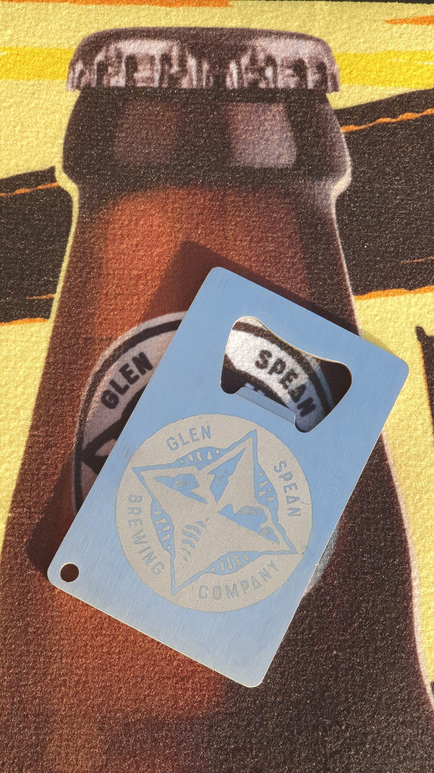 Embossed bottle opener
